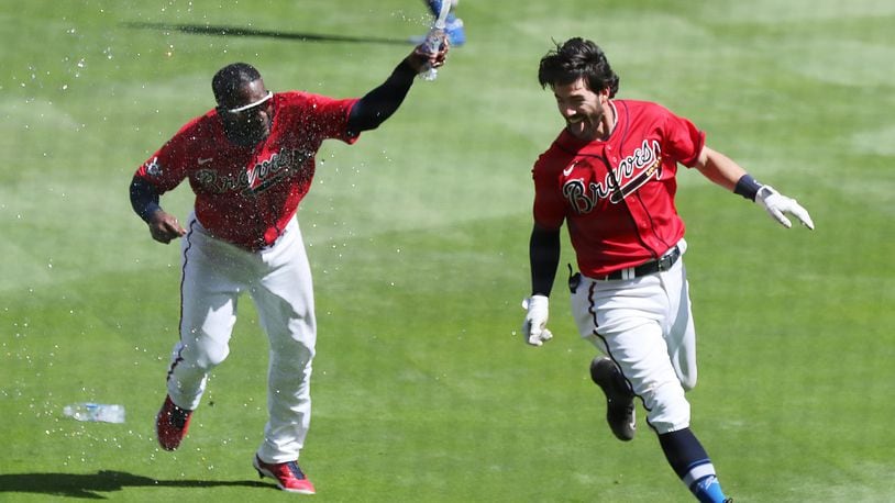 041521 Atlanta: Atlanta Braves shortstop Dansby Swanson hits a walk off single to beat the Miami Marlins 7-6 during the ninth inning of a MLB baseball game on Thursday, April 15, 2021, in Atlanta.   “Curtis Compton / Curtis.Compton@ajc.com”