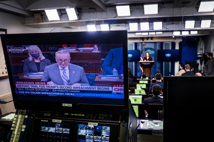 Senate Majority Leader Chuck Schumer (D-N.Y.) is shown addressing the second impeachment trial of former President Donald Trump on a TV monitor at the White House in Washington as White House Press Secretary Jen Psaki holds a  news conference at the White House on Tuesday, Feb. 9, 2021. The second impeachment trial of former President Trump began on Tuesday, about a month after he was charged by the House with incitement of insurrection for his role in egging on a violent mob that stormed the Capitol on Jan. 6. (Pete Marovich/New York Times)