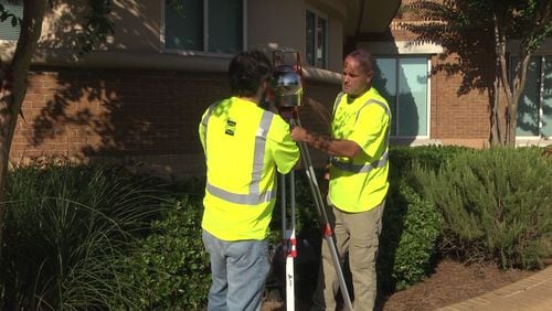 Workers install air monitoring equipment in Cobb County (Courtesy of Cobb County)
