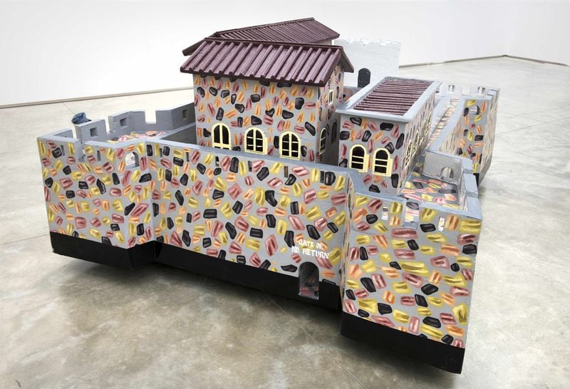 A sculpture by Ghanaian fantasy coffin maker Paa Joe. This is a replica of Fort Gross-Friedrichsburg where thousands of enslaved Africans were held before they were shipped off to the Americas and the Caribbean in the transatlantic slave trade. The replica is part of the High Museum’s new exhibition “Paa Joe: Gates of No Return.” The show was originally done by the American Folk Art Museum in 2018. Photo courtesy of Paa Joe and Jack Shainman Gallery