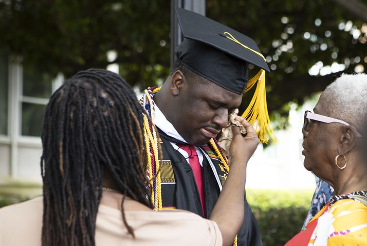 Amir R. Johnson gets emotional after the Morehouse College commencement ceremony on Sunday, May 21, 2023, on Century Campus in Atlanta. The graduation marked Morehouse College's 139th commencement program. CHRISTINA MATACOTTA FOR THE ATLANTA JOURNAL-CONSTITUTION