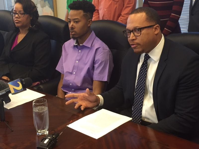 Demetrius Hollins, the 21-year-old man punched and stomped by Gwinnett County Police officers this week, held a news conference Saturday with his mother and attorney. From left to right is Tamara Crenshaw, Hollins’ mother; Demetrius Hollins; and attorney Justin D. Miller.
