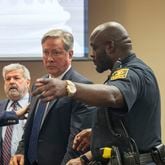 10/14/2019 -- Decatur, Georgia -- Robert "Chip" Olsen is escorted out of the courtroom after being found not guilty of felony murder for his trial in front of DeKalb County Superior Court Judge LaTisha Dear Jackson at the DeKalb County Courthouse in Decatur, Monday, October 14, 2019. The jury did reach guilty verdicts on four lesser charges: two counts of violation of oath of office, aggravated assault and making a false statement. (Alyssa Pointer/Atlanta Journal Constitution)