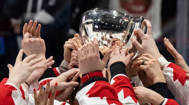 Canada players celebrate after their gold medal win over the United States at the women's world hockey championships in Utica, N.Y., Sunday, April 14, 2024. (Christinne Muschi/The Canadian Press via AP)