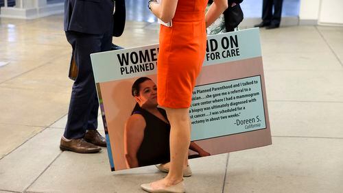 A demonstrator at the Capitol during Senate debate Aug. 3 on defunding Planned Parenthood. (New York Times photo)