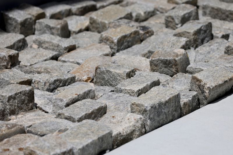 Cobble stones have been preserved at the Canyon as part of the Centennial Yards redevelopment project. The stones were the initial streets of downtown Atlanta before they became covered by the sea of parking spots known as the Gulch. (Jason Getz / Jason.Getz@ajc.com)