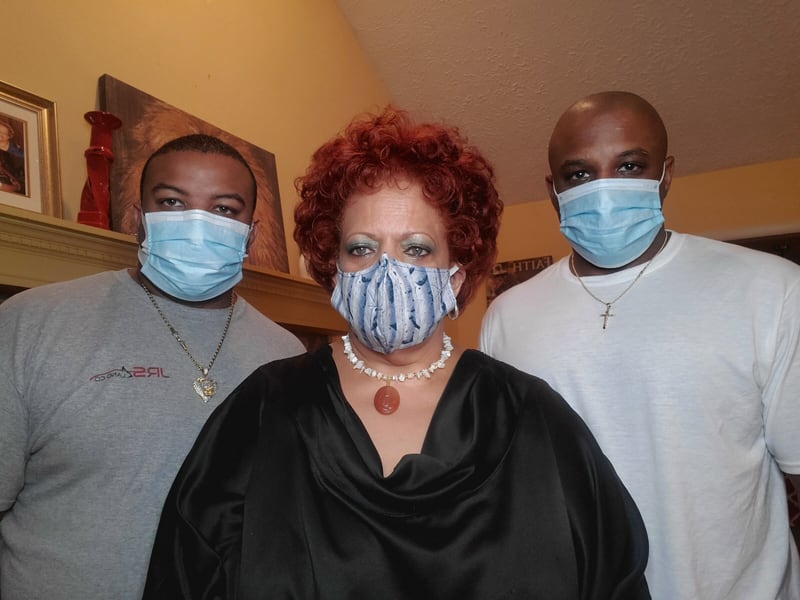 Coronavirus survivor Teresa Sardine, center, with her sons, Jason, left, and Gary. Family photo