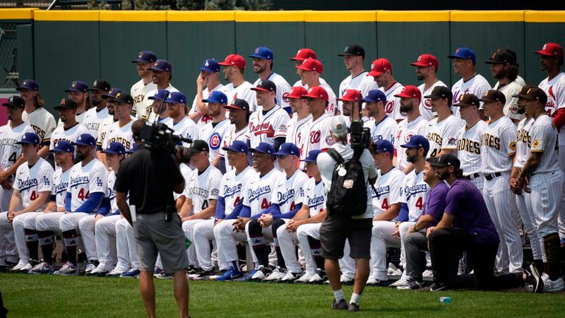 The National League baseball All Stars pose for a team picture in centerfield at Coors Field Monday.