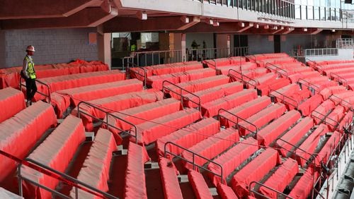 Newly installed seats are covered to prevent possible damage as construction continued on Mercedes-Benz Stadium on Thursday. (Curtis Compton/ccompton@ajc.com)