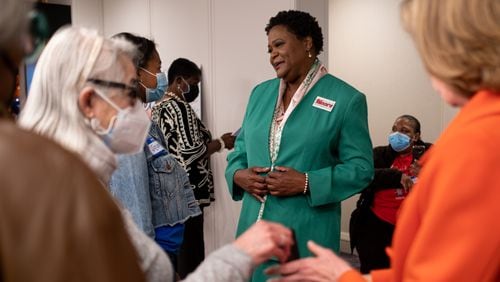 Mayoral candidate Felicia Moore talks with supporters after arriving in downtown Atlanta for a rally Saturday afternoon, Nov. 20, 2021. Ben Gray for the Atlanta Journal-Constitution