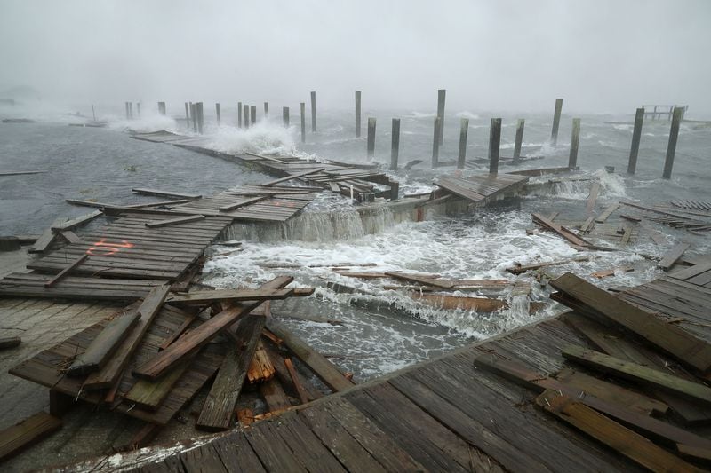   Portions of a boat dock and boardwalk are destroyed by powerful wind and waves as Hurricane Florence arriveed Thursday in Atlantic Beach, N.C.  (Photo: Chip Somodevilla/Getty Images)