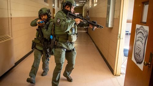 FILE-- Atlanta's SWAT team trains for an active shooter scenario at the old police academy in Atlanta on Tuesday, December 14, 2021.  STEVE SCHAEFER FOR THE ATLANTA JOURNAL-CONSTITUTION