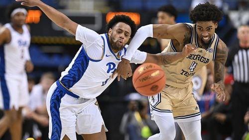 Pitt's Nelly Cummings battles Georgia Tech's Ja'von Franklin during the second half of their game in the second round of the ACC Tournament. (Grant Halverson/TNS)