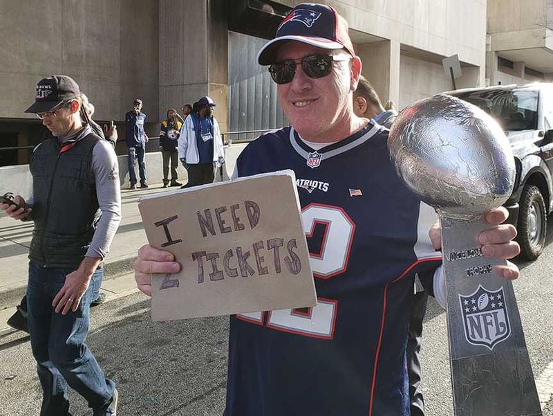 Tom Collins of Boston trying to get tickets to the game after 17-hour drive.