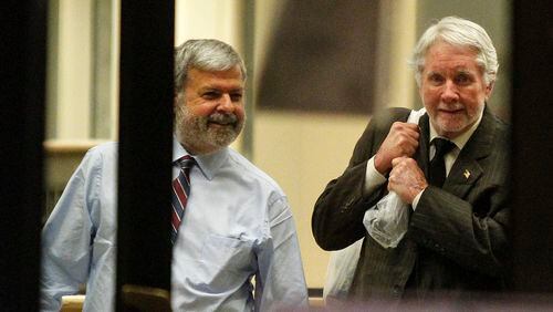 12-11-17 - Atlanta, GA - Tex McIver, 74, (right) and his attorney, Don Samuel, leave the Fulton County Jail Monday night after McIver was released on bond. He was carrying a plastic bag full of papers and books.(CASEY SYKES, CASEY.SYKES@AJC.COM)