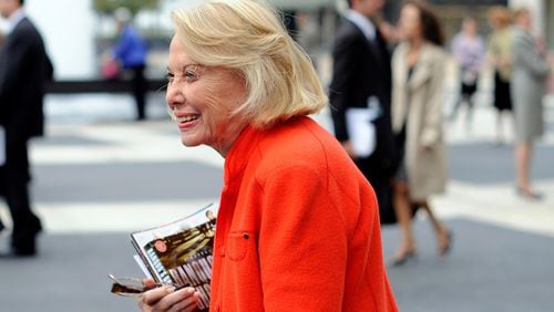 Gossip columnist and writer Liz Smith leaves an event in New York in August of 2009. Smith, a gossip columnist whose mixture of banter, barbs, and bon mots about the glitterati helped her climb the A-list as high as many of the celebrities she covered, has died. She was 94.