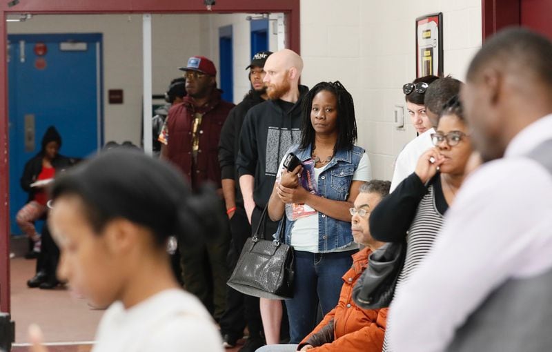 Voters wait in line at Pittman Park Recreation Centers on Tuesday, Nov. 6, 2018.