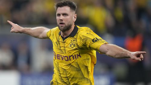Dortmund's Niclas Fuellkrug celebrates after scoring his side's opening goal during the Champions League semifinal first leg soccer match between Borussia Dortmund and Paris Saint-Germain at the Signal-Iduna Park stadium in Dortmund, Germany, Wednesday, May 1, 2024. (AP Photo/Matthias Schrader)
