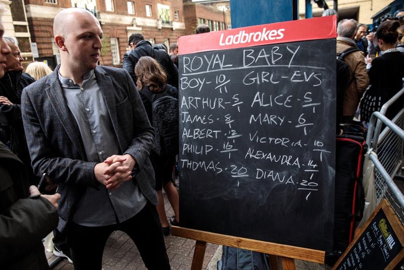 LONDON, ENGLAND - APRIL 23: A bookmaker stands beside a blackboard with odds on babies names ahead of the birth of the Duke & Duchess of Cambridge's third child on April 23, 2018 in London, England. Catherine, Duchess of Cambridge gave birth to a baby boy Monday morning.  (Photo by Jack Taylor/Getty Images)