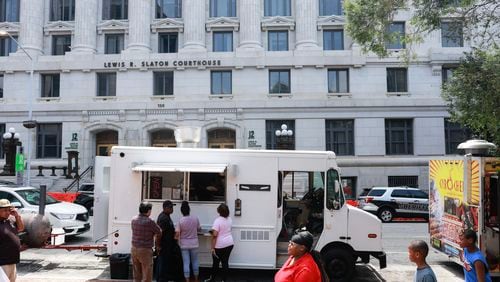 Food trucks were parked along Pryor Street in front of the Fulton County Courthouse on Friday. Road closures near the courthouse are expected to begin next week ahead of a possible fourth indictment involving former President Donald Trump.