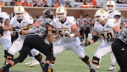 UTC's Corey Levin (62), (70) Hunter Towson and (52) Jacob Revis face off against Mercer. Photo by Contributed Photo /Times Free Press.