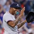 Atlanta Braves closer pitcher Raisel Iglesias celebrates after a baseball game against the Houston Astros, Wednesday, April 17, 2024, in Houston. The Braves won 5-4 in 10 innings.  (AP Photo/Michael Wyke)