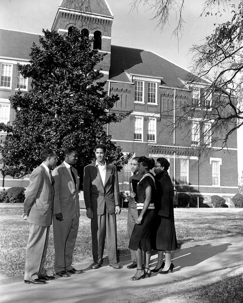 A group of people talk on the grounds of the Morris Brown College in Atlanta, Ga., in this undated photo. Standing from left to right are, Dean Albert Whiting; William Gordon, an instructor at the black college; Ralph Geer; Frederick Hall; Mary Ann Lewis; and Sallie Ivery. (AP Photo)