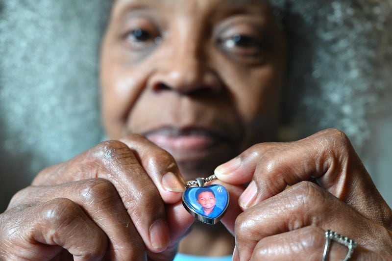 June 8, 2021 Atlanta - Glenda Mack holds a necklace that includes a photo of her grandson David. The 12-year-old was found shot to death in February, not far from their southwest Atlanta home.(Hyosub Shin / Hyosub.Shin@ajc.com)