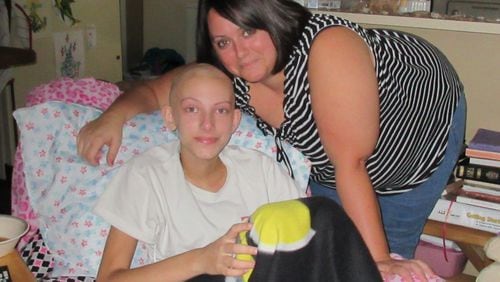 Cristy Rice of Waycross, Ga., with her daughter Lexi Crawford. Lexi was diagnosed in June 2015 with an extremely rare form of cancer. She is one of four children in the southeastern corner of Georgia (three of them in Waycross) who were diagnosed in June and July of 2015 with very rare childhood cancers. That has residents in the region wondering whether the cancers are linked to environmental pollution. Andy Miller/GeorgiaHealthNews.com