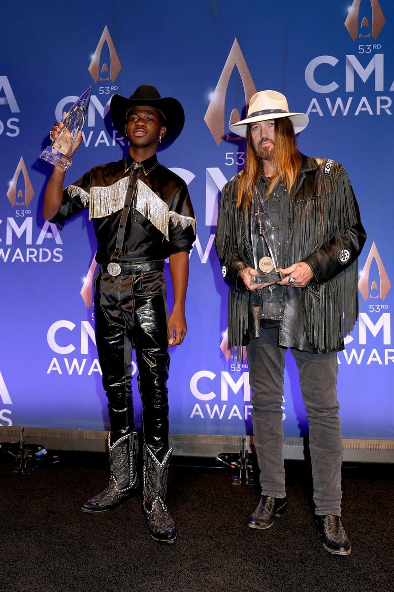 Lil Nas X (L) and Billy Ray Cyrus pose in the press room of the 53rd annual CMA Awards at the Bridgestone Arena on November 13, 2019 in Nashville, Tennessee. (Photo by Leah Puttkammer/Getty Images)
