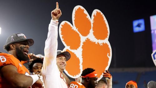 Clemson strikes a familiar pose - Dabo Swinney celebrating with his team after winning another ACC Championship Game. (Streeter Lecka/Getty Images)