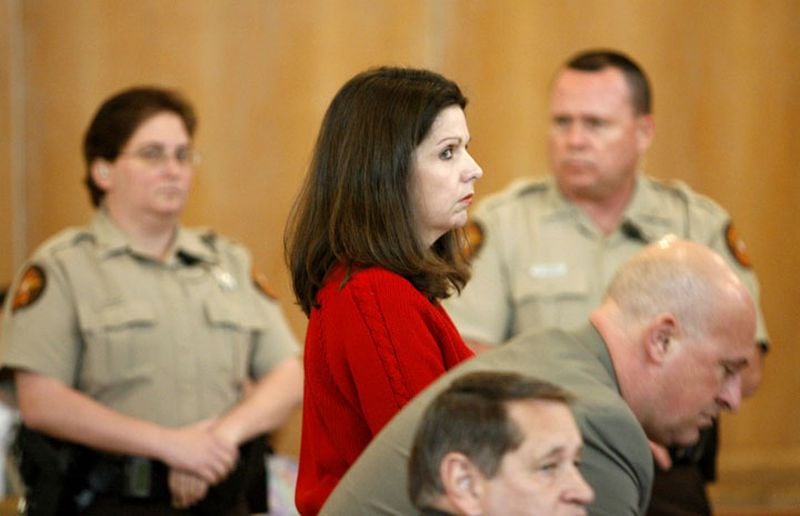 In this 2007 photo, Lynn Turner looks toward the jury as she and defense lawyers Vic Reynolds and Jimmy Berry rise to hear the sentence of life in prison in the antifreeze posioning of Randy Thompson.