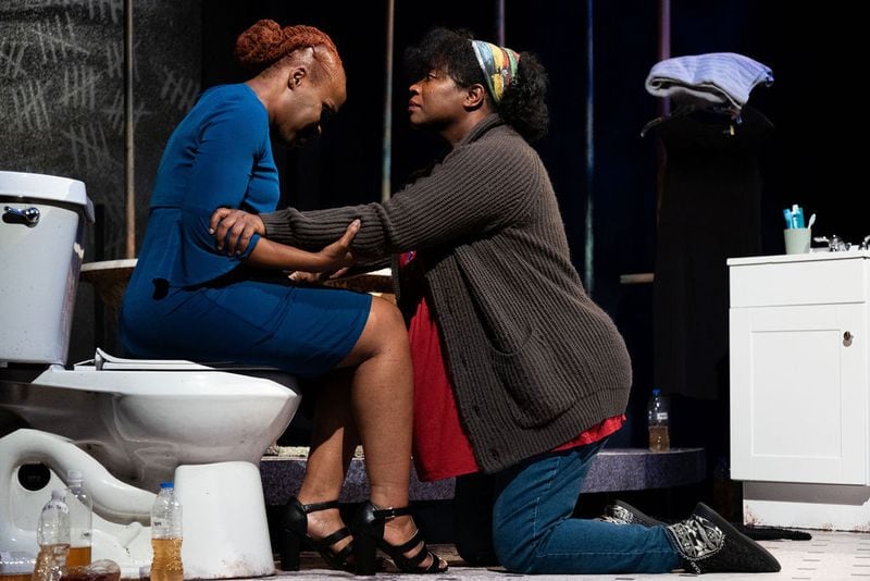 From left, Marion (Marita McKee) and pregnant Ainee (Parris Sarter) are strained by the health and emotional crises of living with contaminated water coming from the taps. Photo: Casey Gardner Ford
