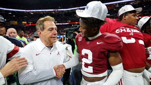 Alabama head coach Nick Saban and Caleb Downs (2) celebrate after defeating Georgia, 27-24, in the SEC Championship at Mercedes-Benz Stadium on Dec. 2, 2023, in Atlanta. (Kevin C. Cox/Getty Images/TNS)