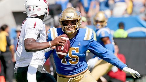 UCLA defensive end Laiatu Latu (15) pressures the quarterback against Washington State at the Rose Bowl on Oct. 7, 2023, in Pasadena, California. (Luis Sinco/Los Angeles Times/TNS)