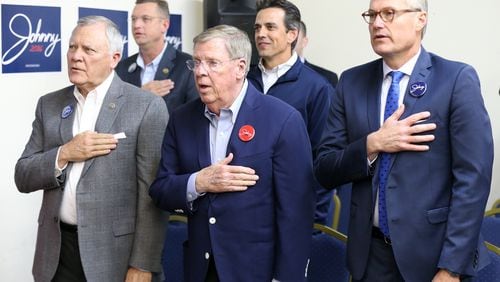 U.S. Sen. Johnny Isakson, center, U.S. Rep. Doug Collins (back, left) and U.S. Rep. Tom Graves (back, center) at a rally in Marietta in November. Curtis Compton,ccompton@ajc.com