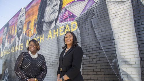 Coretta Whipple (right) and Coretta Hurt pose for a photo in front of a mural featuring Coretta Scott King in Atlanta’s Vine City community, Friday, April 2, 2021. (Alyssa Pointer / Alyssa.Pointer@ajc.com)