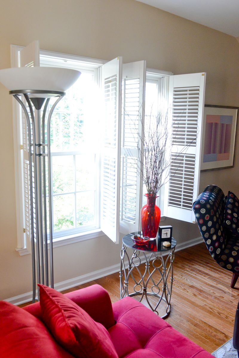 Plantation shutters grace the many windows throughout Pedro Ayestaran Diaz's and Jeffrey Chandler's home. "When we get home, I like to open the windows," said Ayestaran Diaz, a hair stylist at Hairdresser's Inc. in Marietta. "It feels great. I love to come home." Text by Lori Johnston and Keith Still/Fast Copy News Service. (Christopher Oquendo Photography/www.ophotography.com)