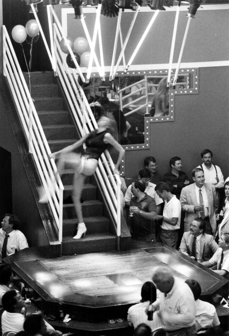 Sept. 28, 1988 - Atlanta, Ga.: - A scantily dressed dancer descends the stairs onto the stage recently at The Gold Club, a nude dancing club at Piedmont Road and Lindberg Drive.