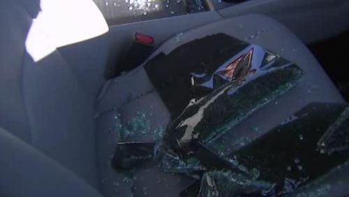 Shattered glass sits in a vehicle that was broken into in Paulding County.