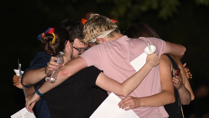 Friends embrace on Monday, September 18, 2017, during a vigil in memory of Scout Schultz, a student and leader in the LGBTQIA community at Georgia Tech. The vigil was held at the Kessler Campanile at Georgia Tech in Atlanta after Scout Schultz was killed during an encounter with campus police. Pride Alliance and Progressive Student Alliance hosted the vigil. (Rebecca Breyer for The AtlantaJournal-Constitution)