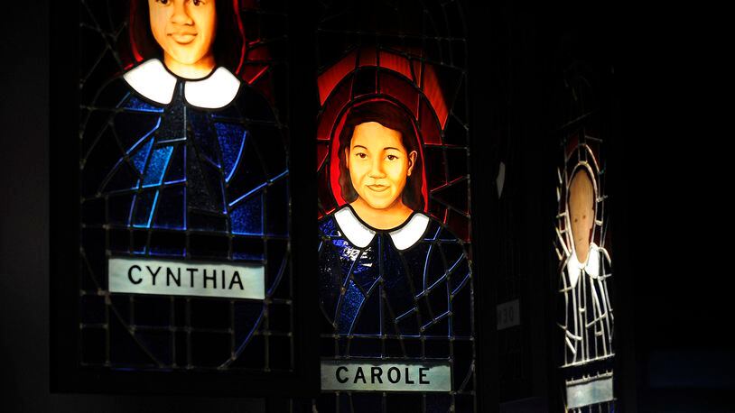 A stained-glass memorial at the National Center for Civil and Human Rights to the four young girls killed in Birmingham David Tulis / AJC Special