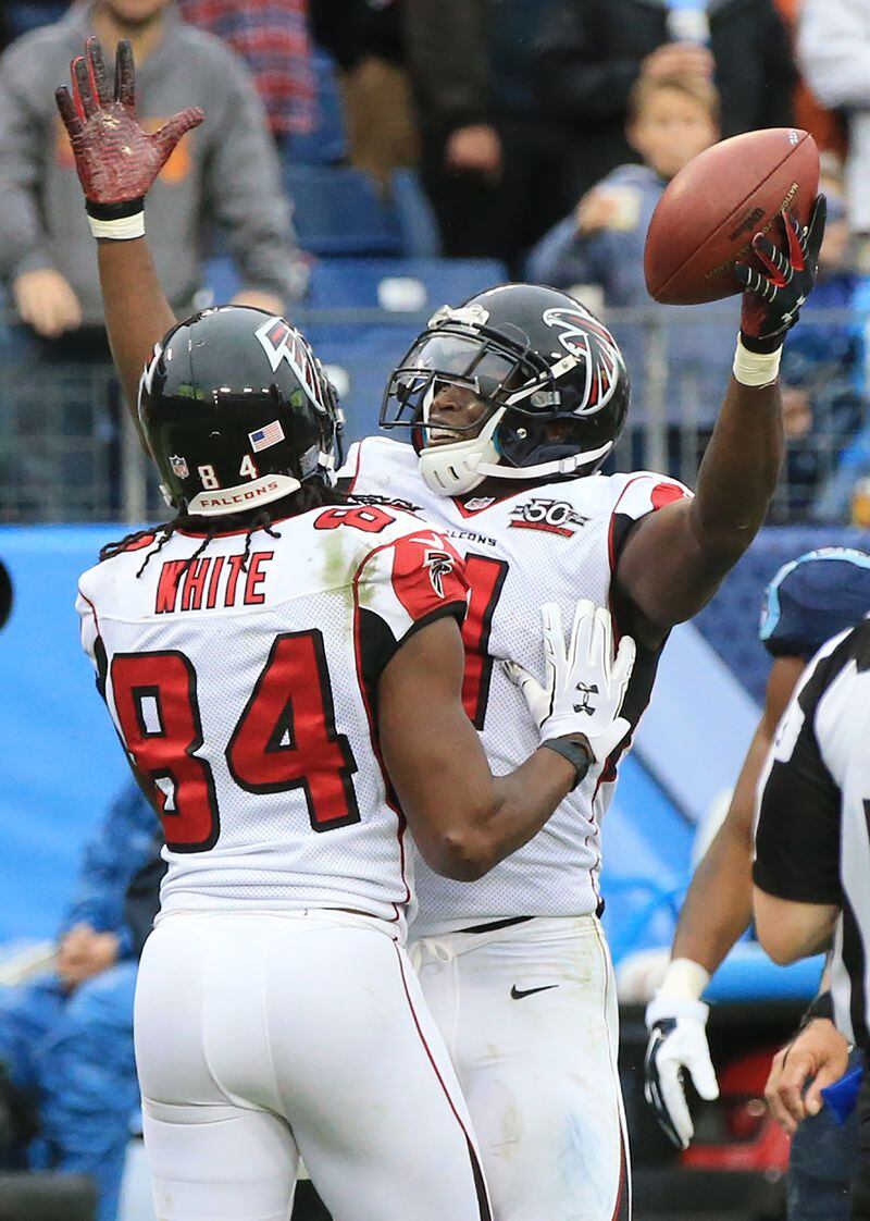 102515 NASHVILLE: -- Falcons wide receiver Julio Jones celebrates what he thought was a touchdown with Roddy White during the fourth quarter against the Titans in a football game on Sunday, Oct. 25, 2015, in Nashville. Officials ruled jones did not get into the endzone on the play. Curtis Compton / ccompton@ajc.com