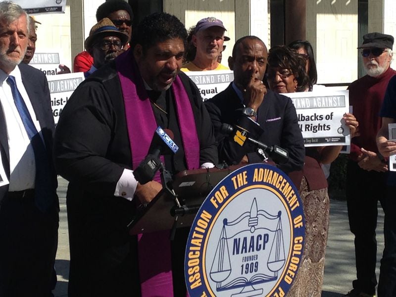 North Carolina's former NAACP leader The Rev. William Barber speaks at a news conference on Friday, Feb. 24, 2016, in Raleigh, N.C., while the former national NAACP president Cornell Brooks looks on. Both left their positions with the NAACP in May. (AP Photo/Jonathan Drew)