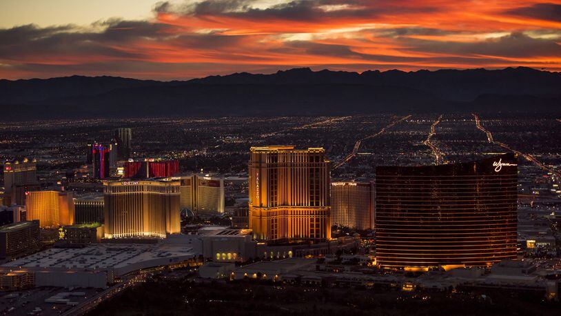 The Venetian (left), The Palazzo (center) and Wynn Resort Holdings hotels stand on The Strip in this aerial photograph taken at dusk above Las Vegas on Aug. 5, 2015. Bloomberg photo by David Paul Morris.