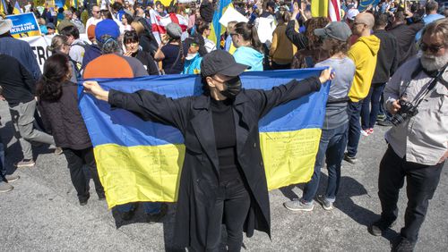 Victoria Tsymbal shows her support along with others for Ukraine during a rally near the CNN center  Saturday, February 26, 2022.  STEVE SCHAEFER FOR THE ATLANTA JOURNAL-CONSTITUTION