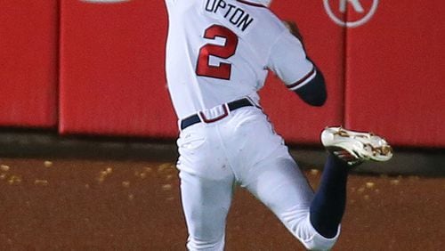 Braves outfielder Justin Upton fails to come up with ball that ended up a triple for Phillies Cole Hamels in the third inning in Monday's 5-1 loss to Philadelphia at Turner Field.