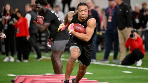 Georgia running back Kendall Milton makes a cut in front of coaches and scouts during Georgia Pro Day at Payne Indoor Athletic Facility, Wednesday, Mar. 13, 2024, in Athens. (Hyosub Shin / Hyosub.Shin@ajc.com)