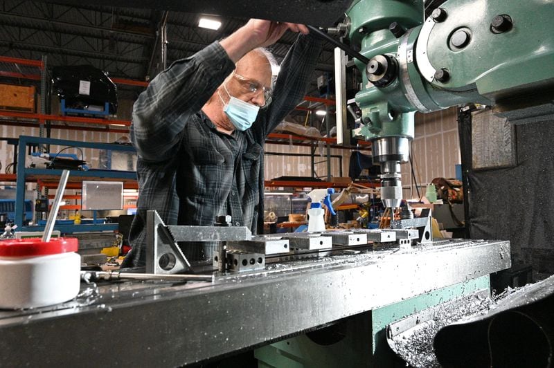 Carl Thurston runs a machine at Winton Machine Company in Suwanee on Tuesday, February 16, 2021. (Hyosub Shin / Hyosub.Shin@ajc.com)