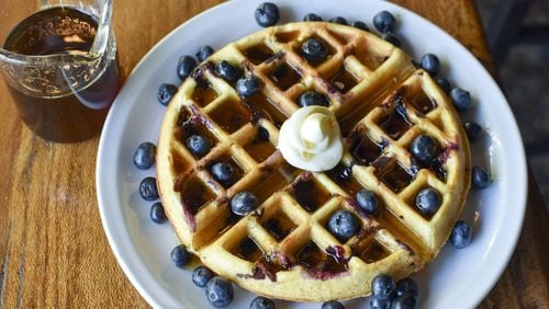 Chef Ryan Burke of Twain’s Brewpub and Billiards in Decatur makes Blueberry-Bacon Waffles with with Orange-Maple Syrup for his family. CONTRIBUTED BY HENRI HOLLIS